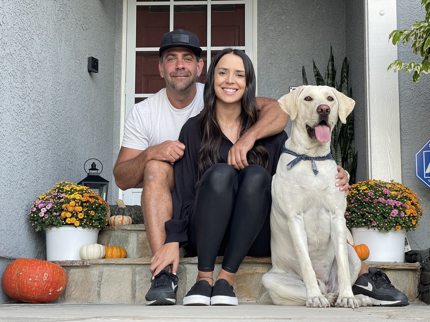 Rocky, his wife Rachael, and River — the dog PET-Tides was built for — on their front porch